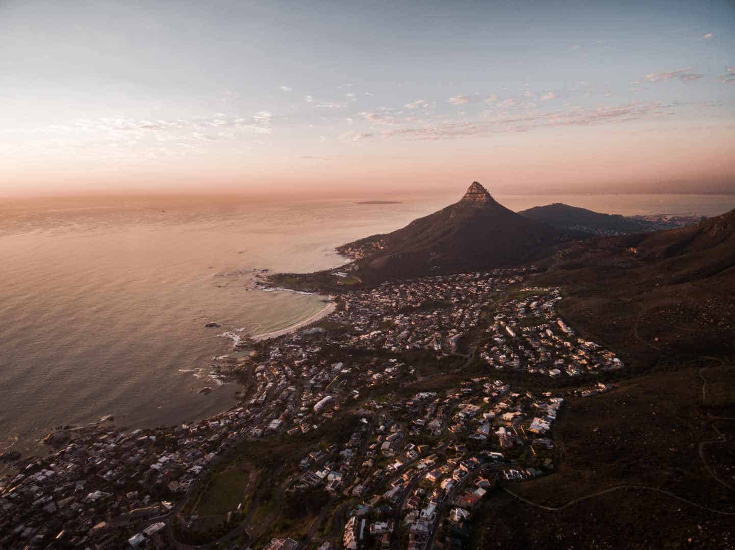 Sunset in Camps Bay at the far end of the world. Photo by Finding Dan | Dan Grinwis on Unsplash