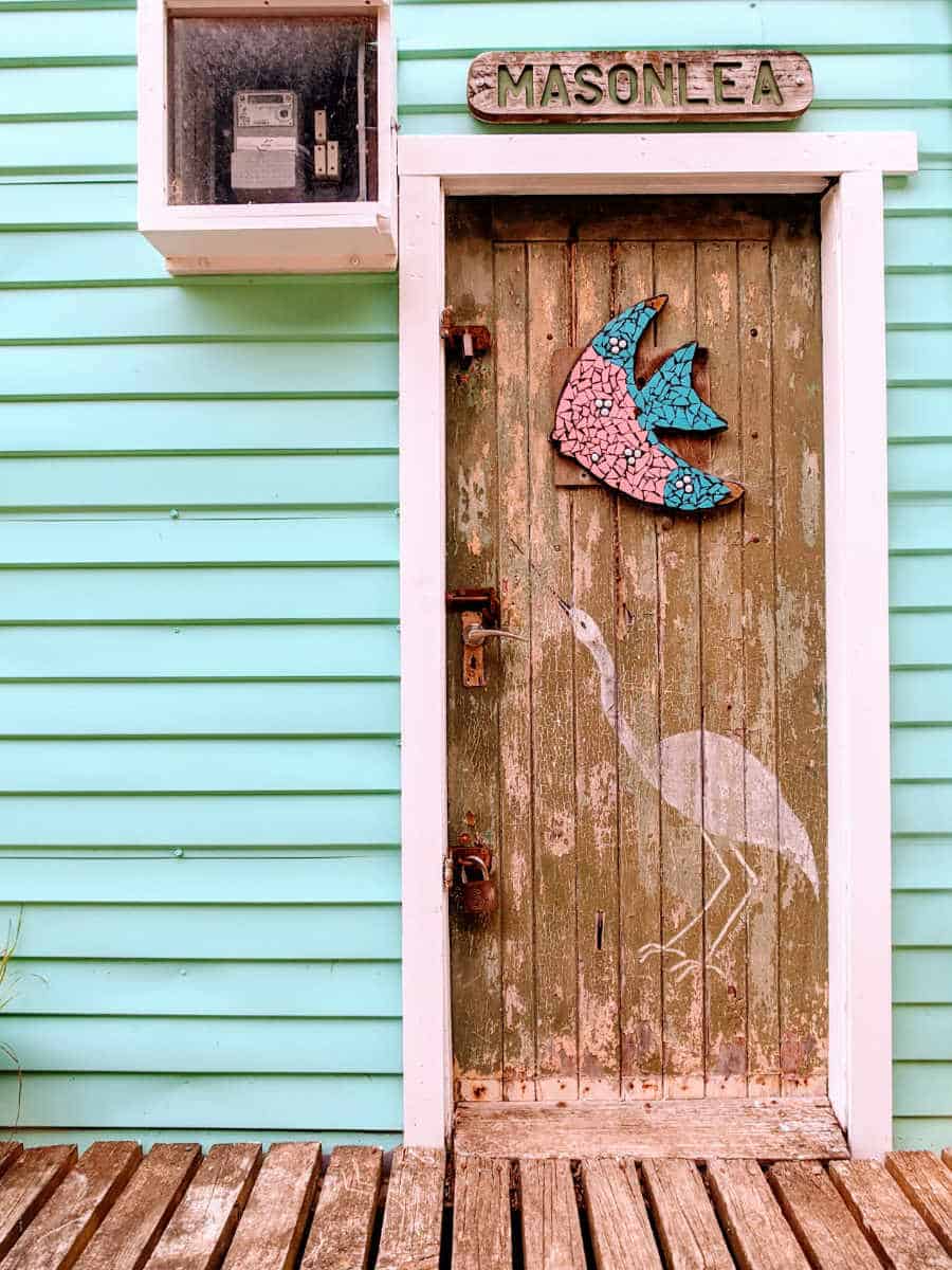 Colorful front door of a boatshed along the Camborne Walkway.